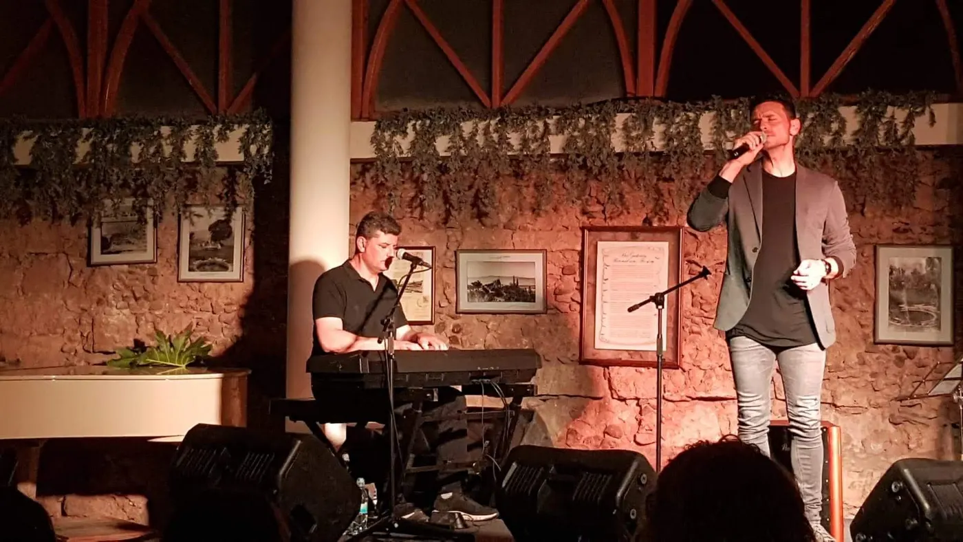 A singer and a pianist performing at an event